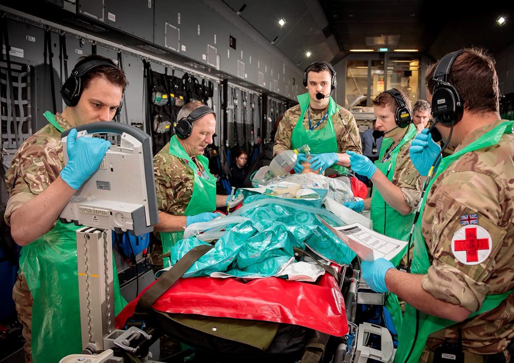RAF Medics work with patient.